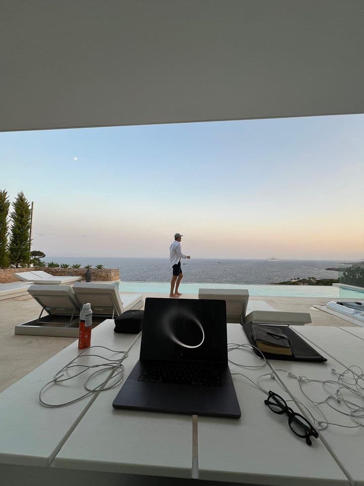 Laptop on a table overlooking the ocean