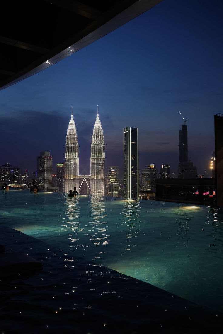 the city skyline is lit up at night
